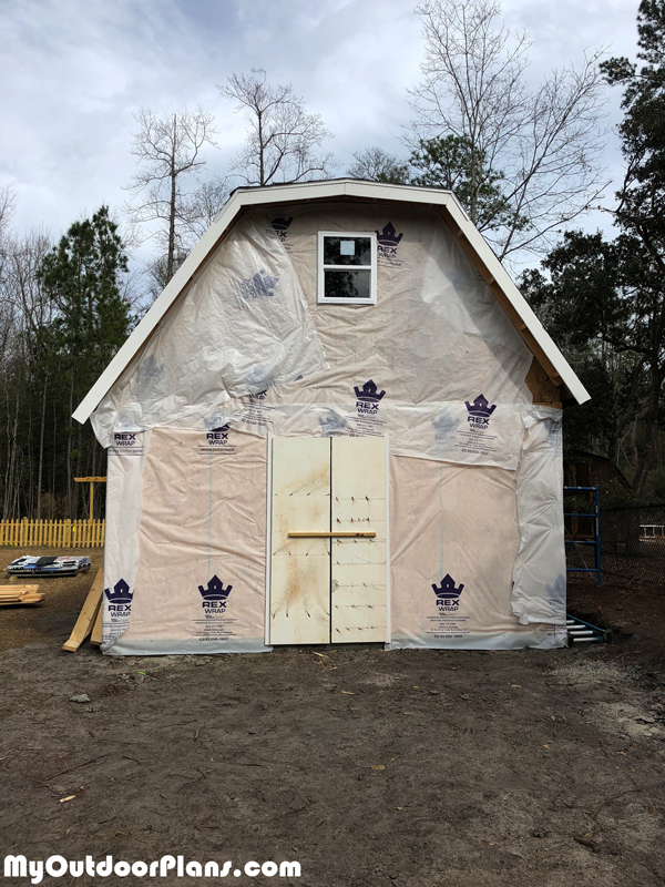 Wrapping-the-shed-with-paper